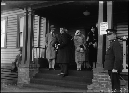 Royal Visit, May 1927. Duke and Duchess of York with Prime Minister  Rt Hon S M Bruce at Canberra Railway Station Notice on the pillar reads "Canberra Anglican Cathederal Site. Sunday May 8th Open Air Service".