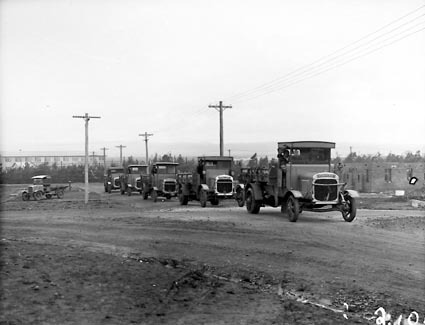 Five Thorncroft motor trucks and a smaller motor truck