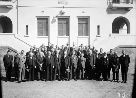 Group photographs of delegates to the Labour Conference outside East Block with hats off.