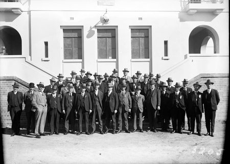 Group photographs of delegates to the Labour Conference outside East Block with hats on.