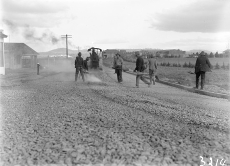 Road making in Mort Street, south from Canberra Times Office. Civic Centre buildings in the background.