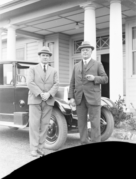 Sir John Butters and Sir John Hanson outside Acton Offices with Armstrong Siddeley car.