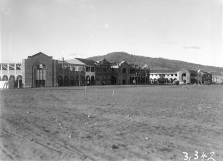 Construction of Civic Centre Buildings from south west. Mount Ainslie at the rear, Melbourne building on left, Sydney building on right.