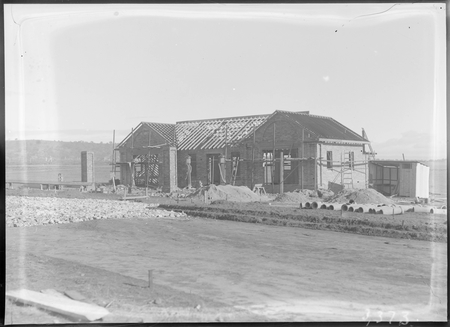 Garage under construction with petrol pumps, Mort Street, Braddon.