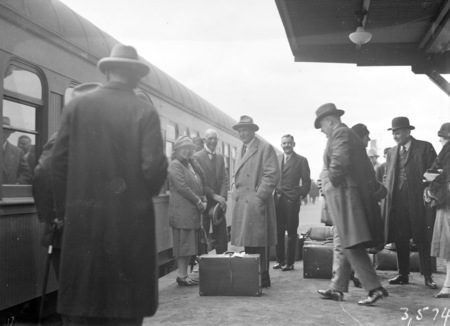 The Rt Hon Stanley Melbourne Bruce boarding a train.