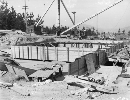 Construction site, Mount Stromlo Observatory with crane of W H Mason, Builders, Queanbeyan.