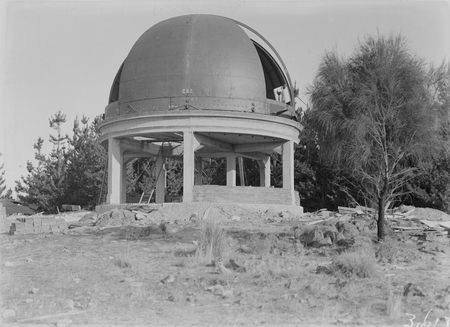 Construction, Mount Stromlo Observatory showing partially built observatory dome.