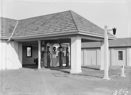 Garage in Mort street with petrol pumps.