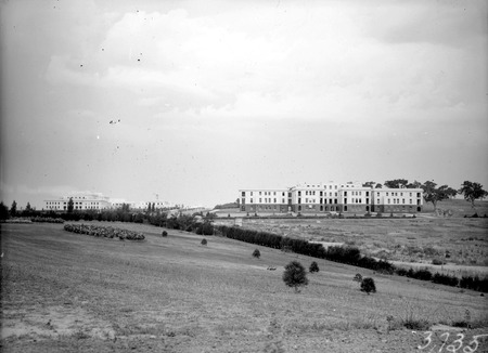  Parliament House on left and West Block  Offices from the grounds of Hotel Canberra