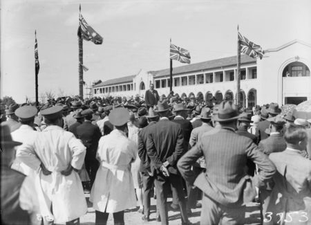 Formal opening of Civic Centre by Prime Minister S.M.Bruce. Part of the crowd; men in white coats are bus drivers.