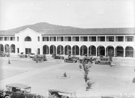 Northbourne Avenue from Melbourne Building with motor cars. Mount Ainslie in background.