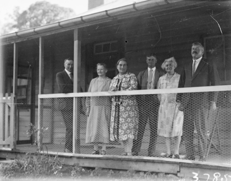 Group of people on a verandah.