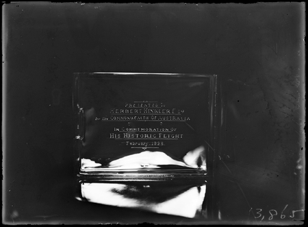 Inscription on presentation cigarette case presented to Bert Hinkler by Commonwealth Government.