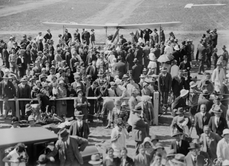 Arrival of Captain W.N. Lancaster and Mrs Keith Miller in aircraft "Red Rose" at the Review Ground opposite Hotel Kurrajong.