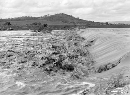 Floodwaters over the Kingston Power Station weir.