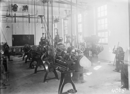 Machine shop with lathes, shapers, milling machines. Technical School.