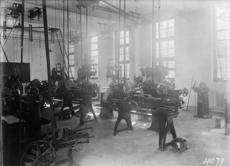 Machine shop with lathes, shapers, milling machines. Technical School.