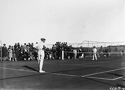 Game of tennis singles in progress at the opening of the new Canberra Tennis Association Central Courts, Manuka