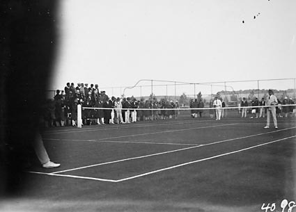 Game of tennis doubles in progress at the opening of  the new Canberra Tennis Association Central Courts, Manuka.