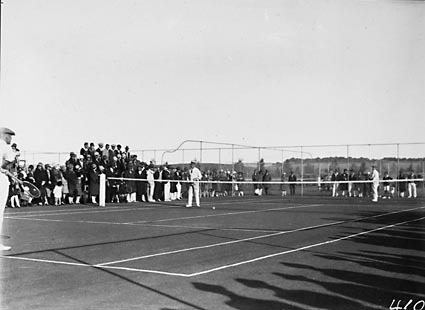 Game of tennis doubles in progress at the opening of the new Canberra Tennis Association Central Courts, Manuka