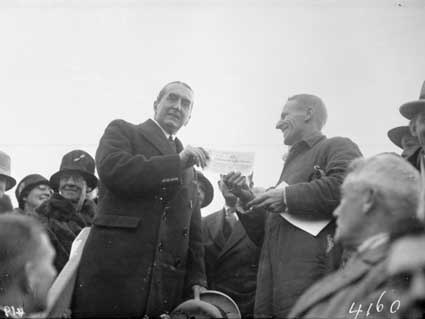 Rt Hon. S M Bruce making presentation of cheque for 5000 pounds to Charles  Kingsford Smith