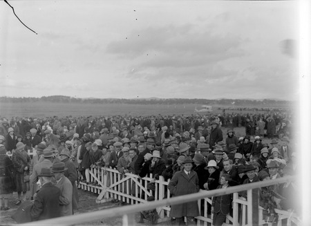 Part of the  crowd at the air force landing ground near Duntroon (now Fairburn) to welcome Kingsford Smith