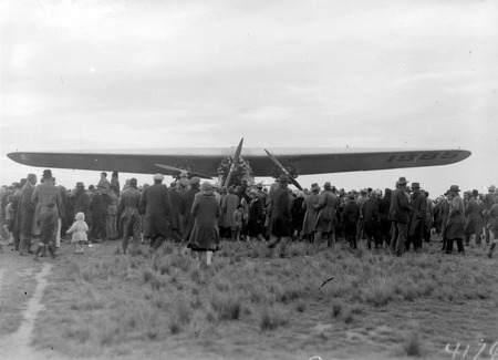  Kingsford Smith's Fokker Trimotor type FV111 B/3M aircraft, Southern Cross and crowd at the air force landing ground near Duntroon (now Fairburn)