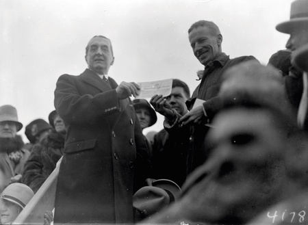 Rt Hon. S M Bruce making presentation of cheque for 5000 pounds to Charles  Kingsford Smith
