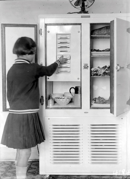 Girl at a two door  refrigerator