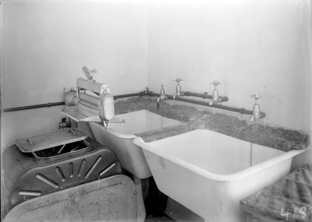 Laundry tubs  with a wringer  type washing machine