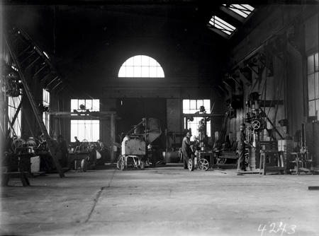 Kingston Power Station workshops with machine tools and a concrete mixer under repair
