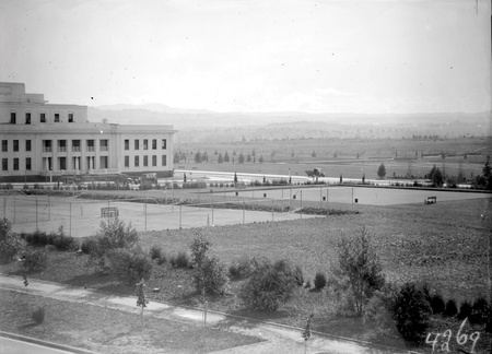 Parliamentary tennis courts, bowlimg green and House of Representatives gardens from East Block
