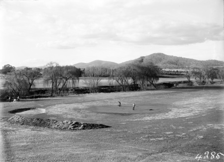 Golfers on the green, Molonglo River behind.