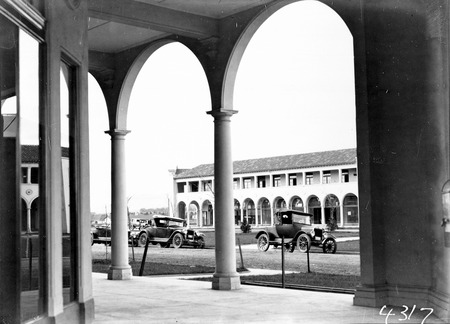 Sydney Building, Northbourne Avenue and Motor Cars from Colonnades of Melbourne Building
