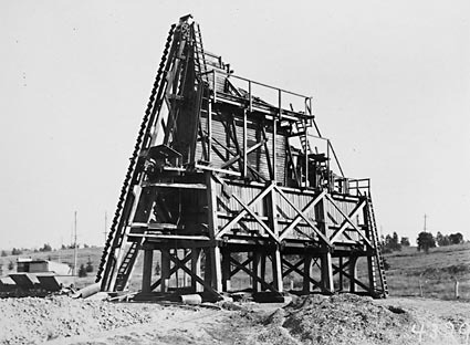 Sand washing and screening  plant with narrow gauge tram tracks and skips on the banks of  the Molonglo River