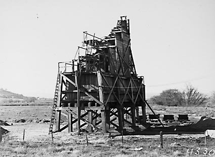 Sand washing and screening  plant with narrow gauge tram tracks and skips on the banks of  the Molonglo River