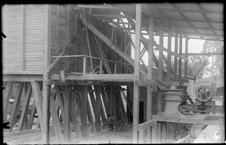 Mugga Quarry. Rock storage bins on right. Chute to feed rock to gyratory crusher, jaw breaker crusher on the left.