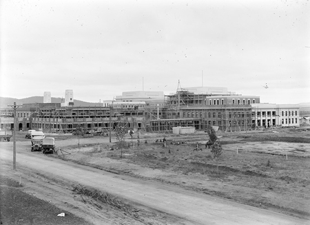 Parliament House under construction from Queen Victoria Terrace.
