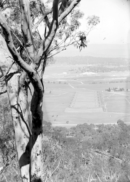 ANZAC Parade (was called Gallipoli Parade until 1928) from Mount Ainslie - Parliament House in background - St Johns Church on right - Scotts crossing over the Molonglo River- Red Hill on the horizon