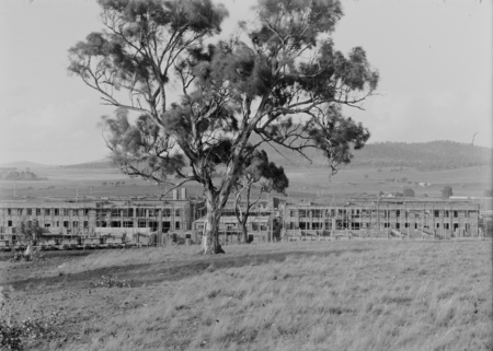 Parliament House under construction, from Camp Hill. Mount Ainslie in background.