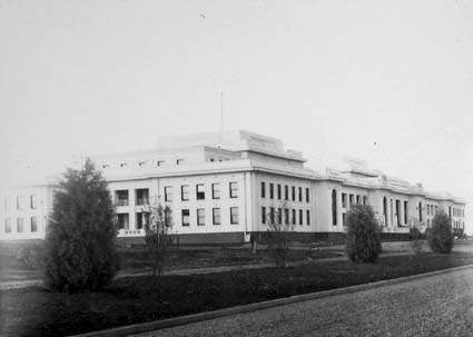 Parliament House on completion, with Arizona Cypress interplanted with flowering plums 