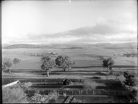 View from Yarralumla looking west - Yarralumla Woolshed in centre - Fenced vegetable garden in foreground