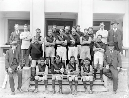 Acton Australian Rules team with officials.