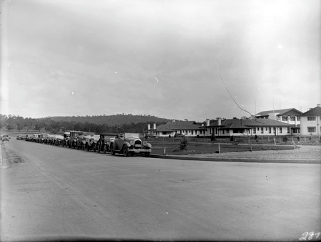 Line of Royal Automobile Club cars outside Hotel Canberra