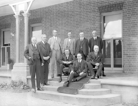 Federal Cabinet (Bruce/Page) without Bruce at first meeting in Canberra held at Yarralumla. Sir Littleton Groom is sitting on the carpet.