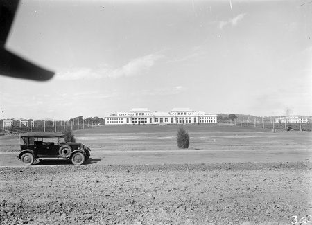 Parliament House with seating on the left and right for opening ceremony. Mildenhall's Armstrong Siddeley on left.