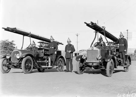 Canberra Fire Brigade with uniformed firemen and appliances, one on the right is an Albion.