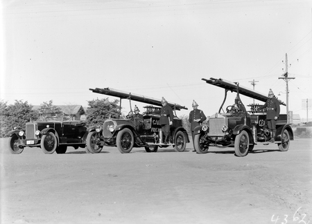 Canberra Fire Brigade with uniformed firemen and appliances, one on the right is an Albion.