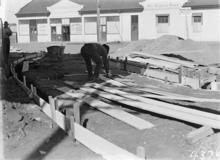 Laying a driveway for a Garage in Mort Street Braddon. Canberra Times Office and Post Office in background.