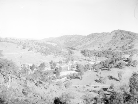 Murrumbidgee River Bridge and Cotter Pump House. Construction camp in foreground following the flood damage of 1922 and rebuilding the bridge.